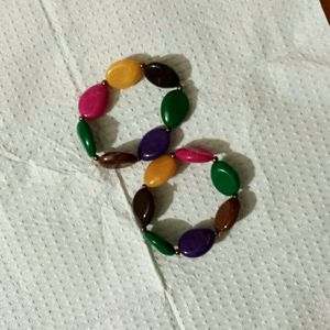 Multi color bracelets. Round stone like beads